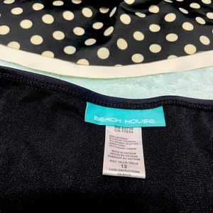 2 piece blouse like tankini size 12. Bottoms have a skirt on top.